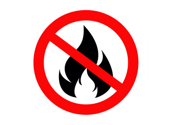 An icon of a fire with a red circle around it with a red line through the middle