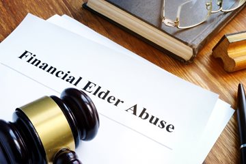 A gavel and paper that says financial elder abuse